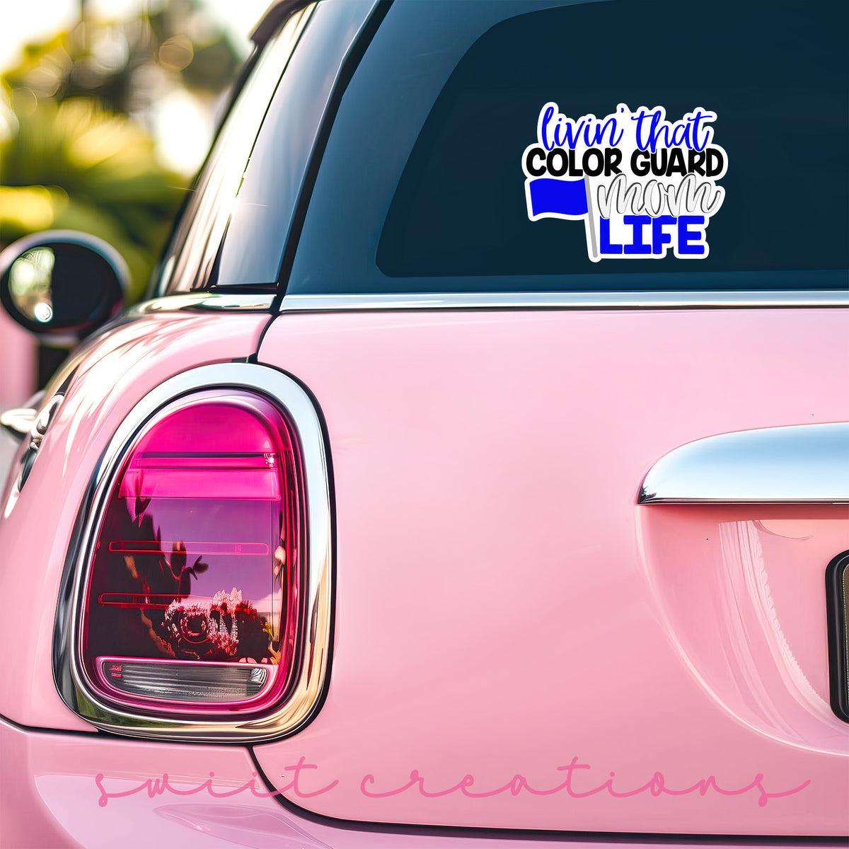 a pink car with a sticker that says color guard life