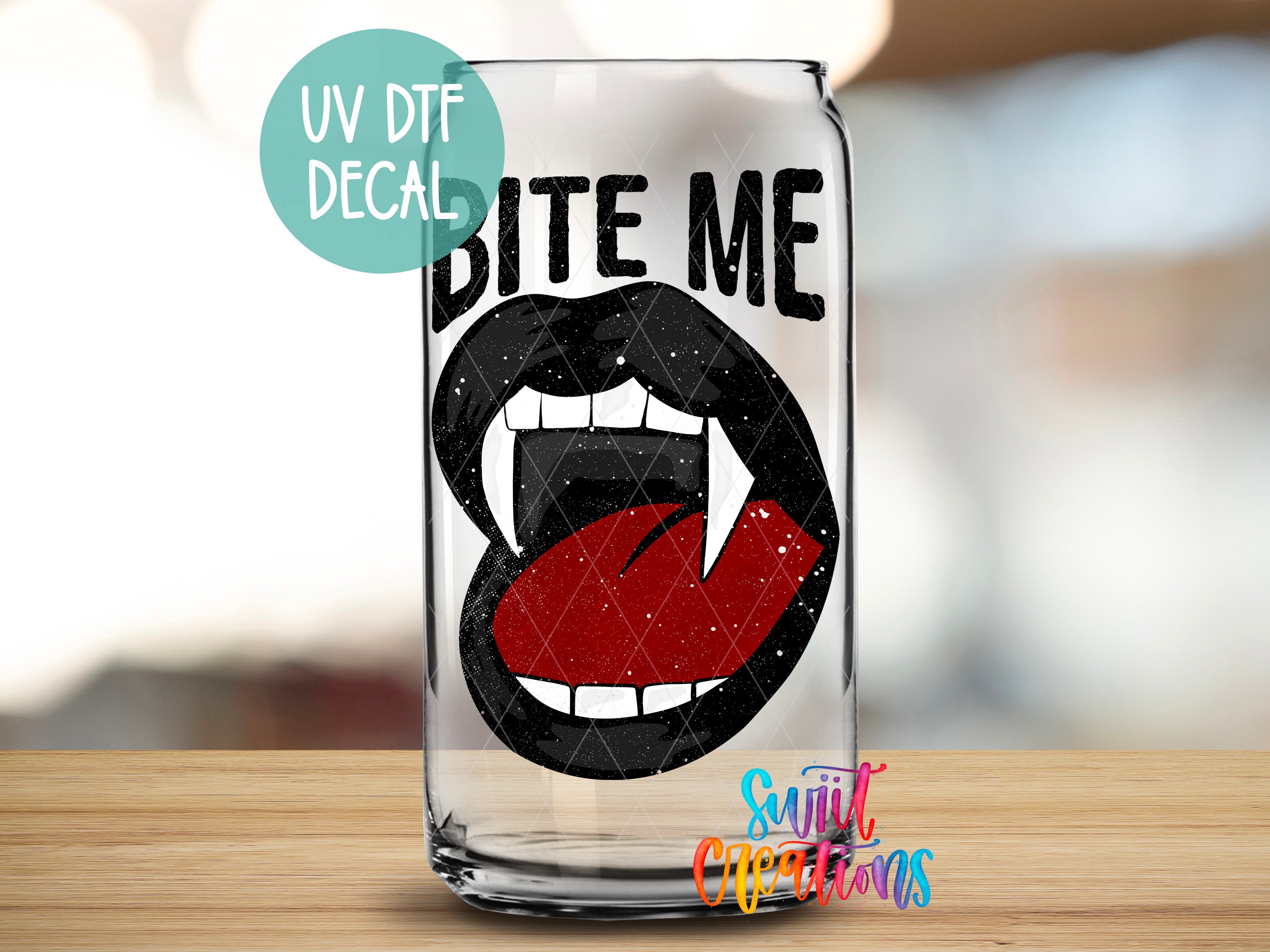 a glass with a mouth and tongue on it