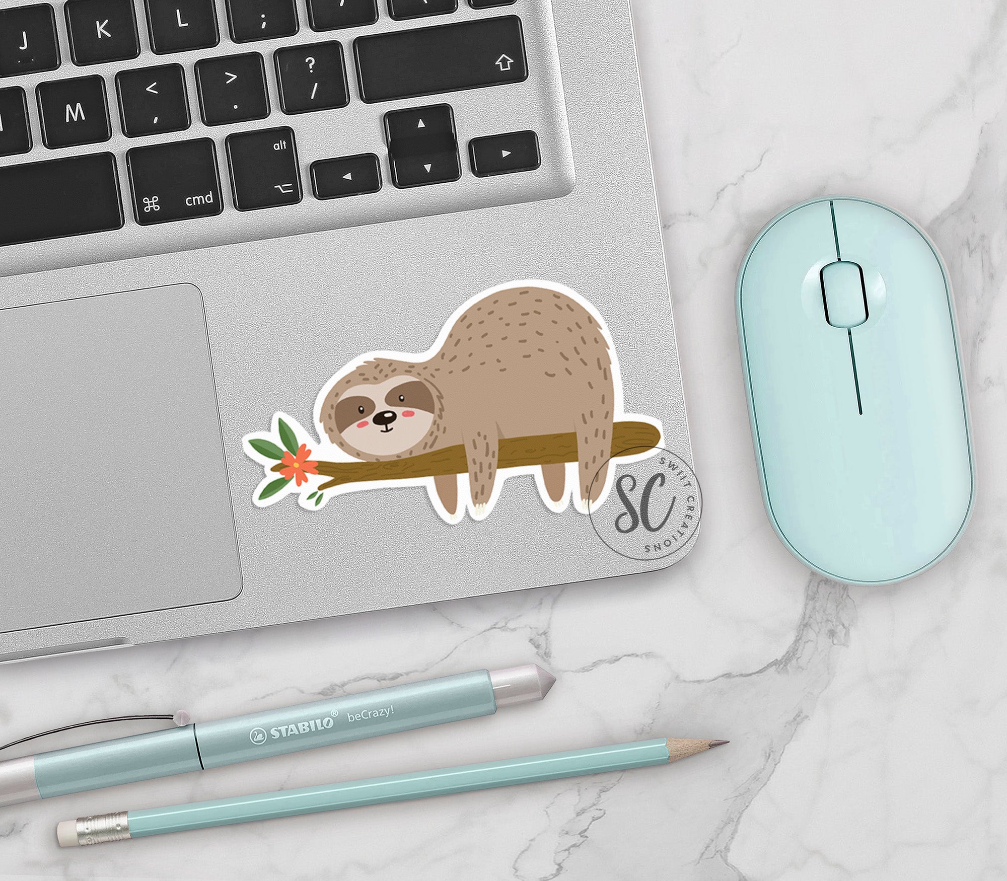 a sticker of a slotty on a tree branch