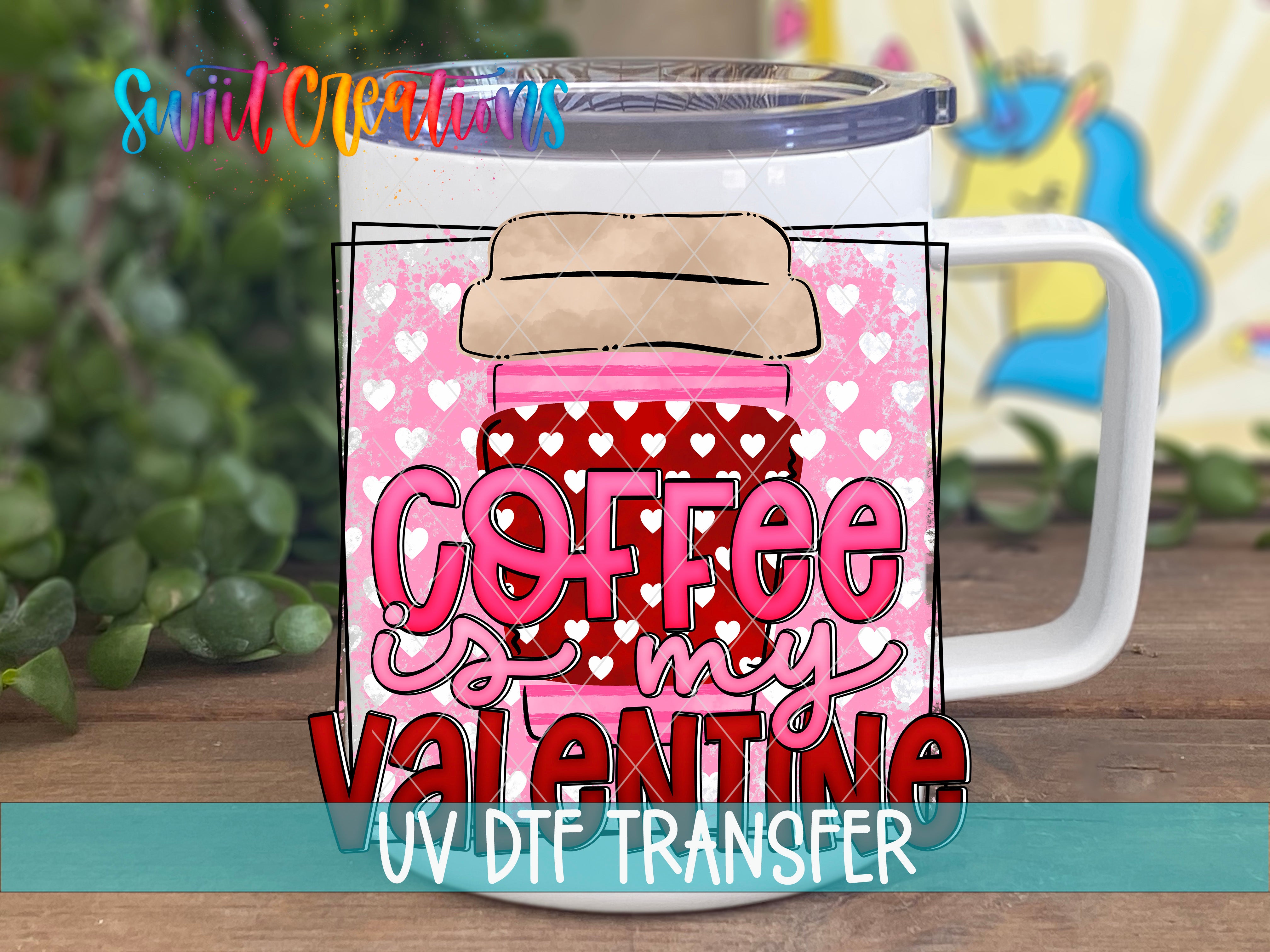 A white mug with a pink and red design featuring the text "Coffee is my Valentine" and a cartoon character.