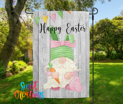 A banner with a cartoon image of a gnome holding a carrot and the text "Happy Easter" is displayed in a garden setting.