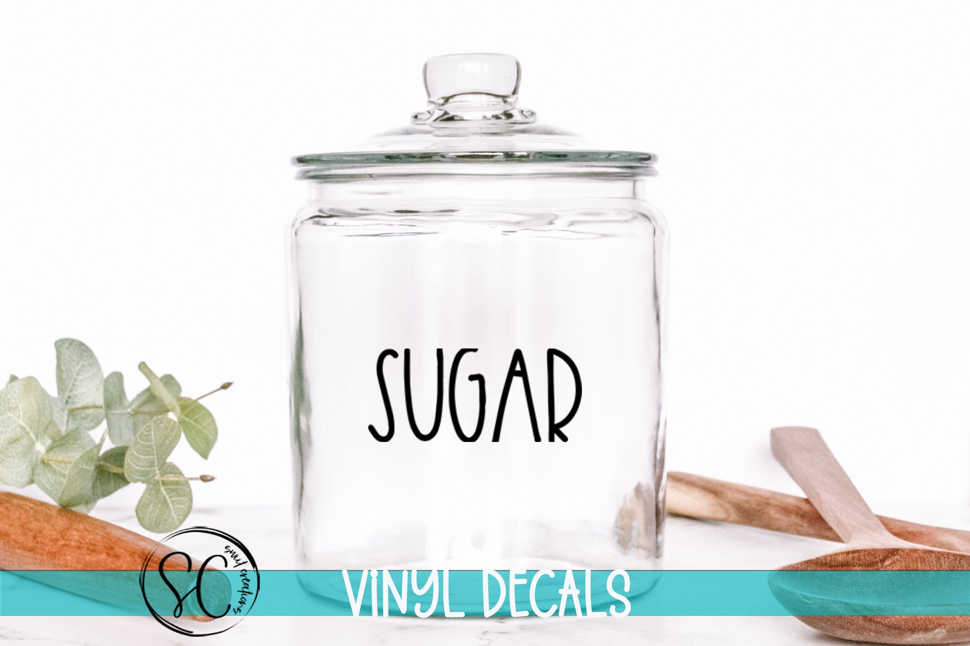 a glass jar with the word sugar on it