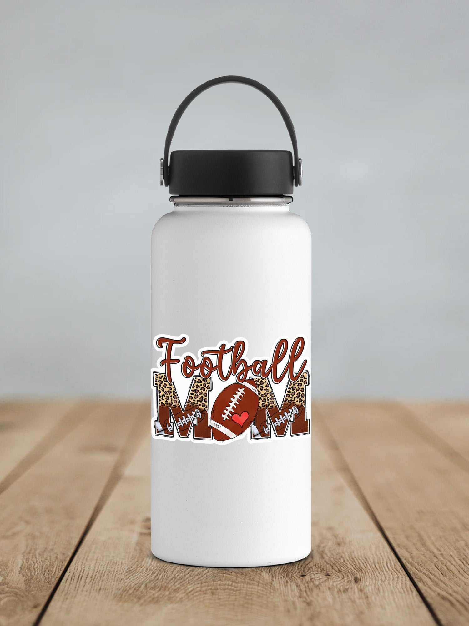 a white water bottle with a football mom on it