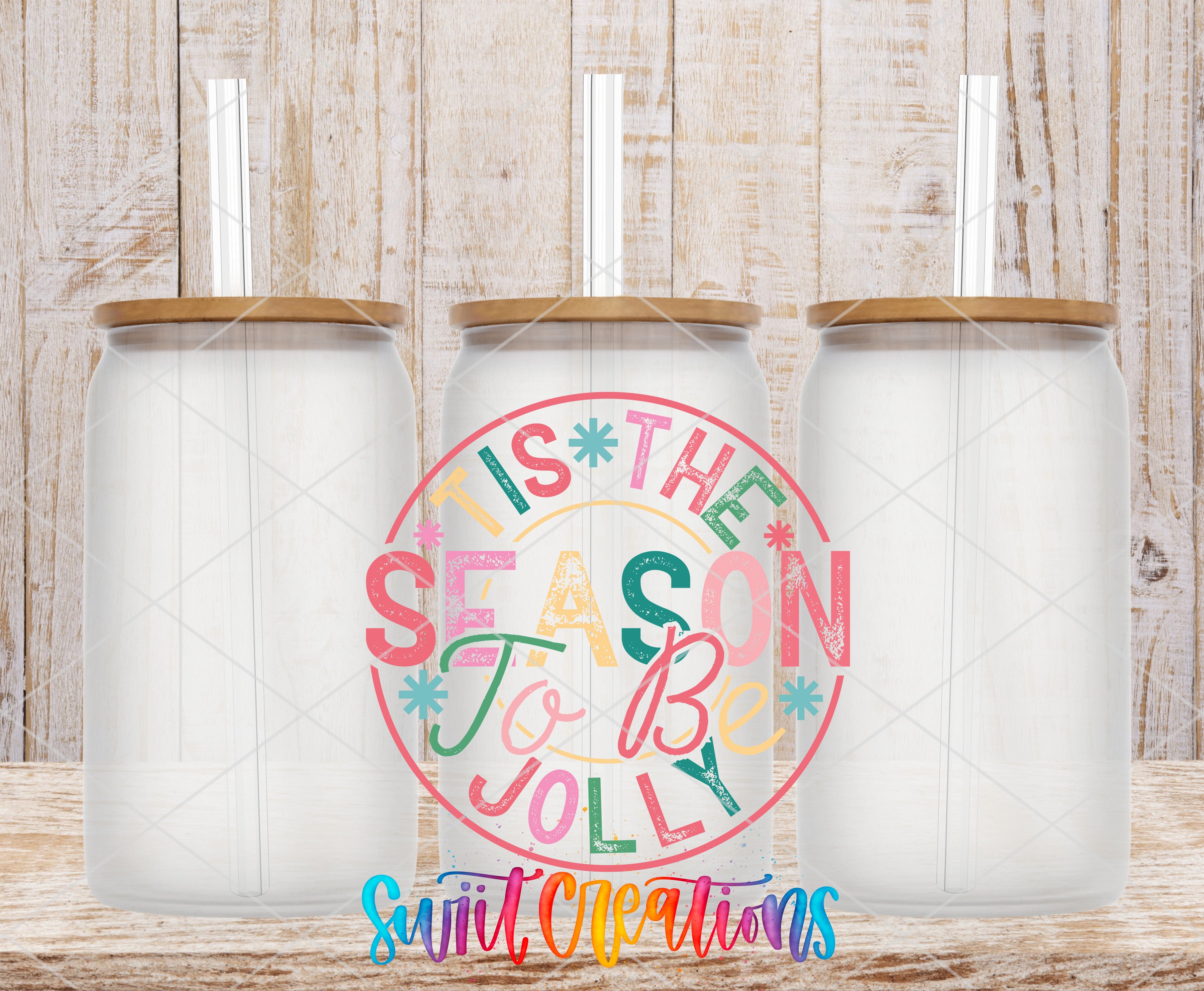 three clear glass jars with wooden lids, arranged in a row against a wooden background. In the center of the image, there is a circular design with text that reads "This is the season to be jolly", surrounded by colorful illustrations.