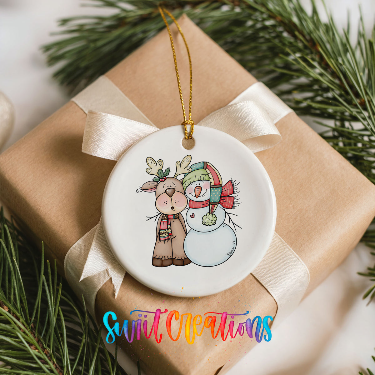 Reindeer and snowman Christmas ornament arranged on a wrapped gift