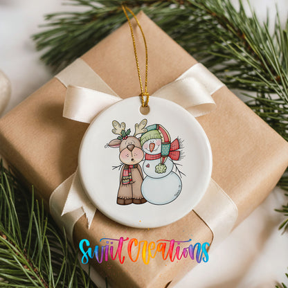 Reindeer and snowman Christmas ornament arranged on a wrapped gift
