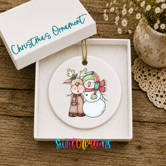 Reindeer and snowman ceramic Christmas ornament in included gift box