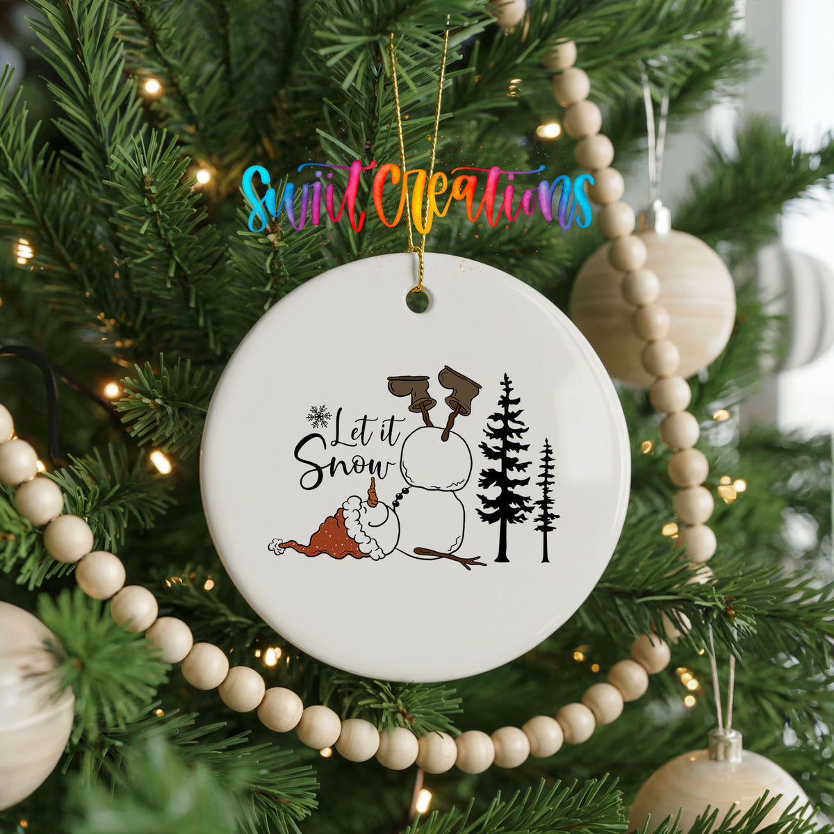 Let It Snow snowman winter forest ceramic Christmas ornament hanging on a decorated Christmas tree