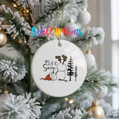Let It Snow snowman winter forest ceramic Christmas ornament hanging on a frosted Christmas tree