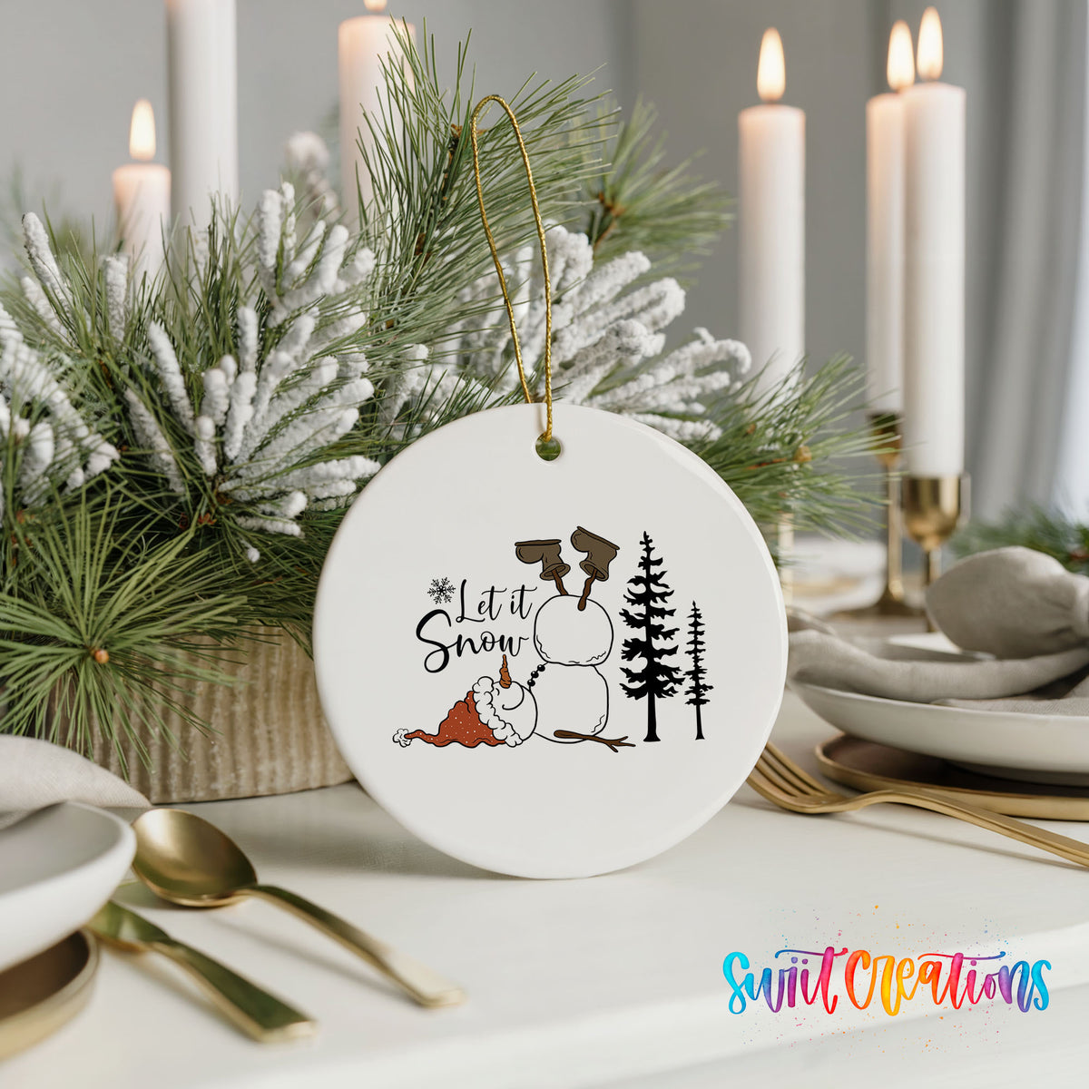Let It Snow snowman winter forest ceramic Christmas ornament displayed with elegant holiday table decor