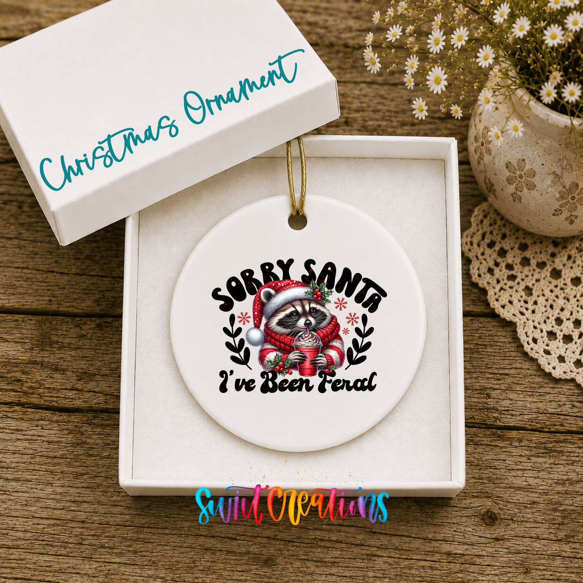 Sorry Santa I've Been Feral funny raccoon ceramic Christmas ornament displayed in the included gift box
