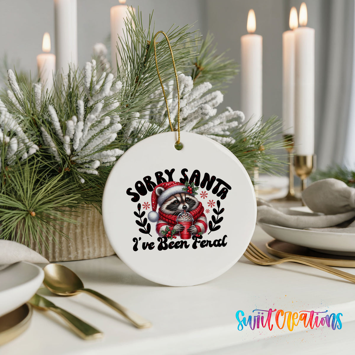 Sorry Santa I've Been Feral funny raccoon ceramic Christmas ornament displayed with elegant holiday table decor