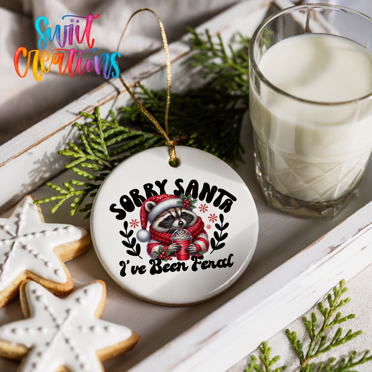 Sorry Santa I've Been Feral funny raccoon ceramic Christmas ornament styled with cookies and milk