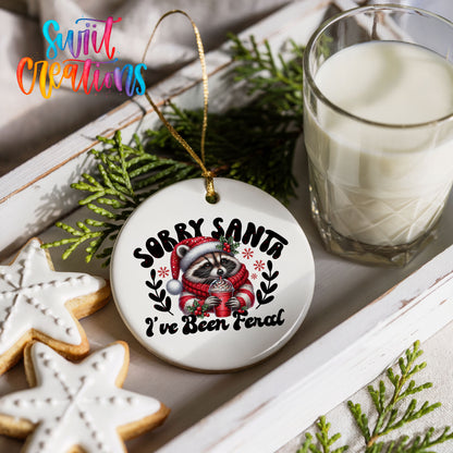 Sorry Santa I've Been Feral funny raccoon ceramic Christmas ornament styled with cookies and milk