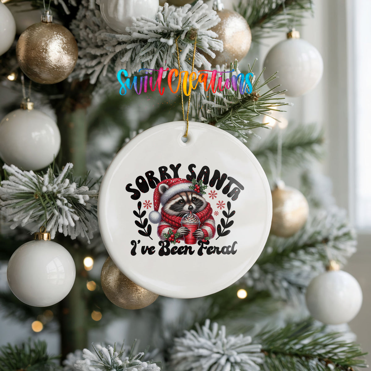 Sorry Santa I've Been Feral funny raccoon ceramic Christmas ornament hanging on a frosted holiday tree
