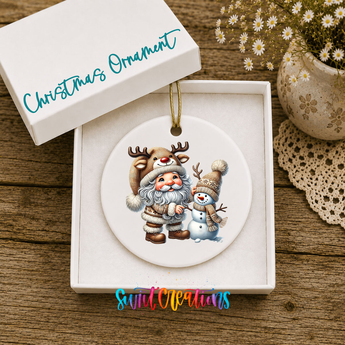 Whimsical Santa reindeer and snowman ceramic Christmas ornament displayed in the included gift box