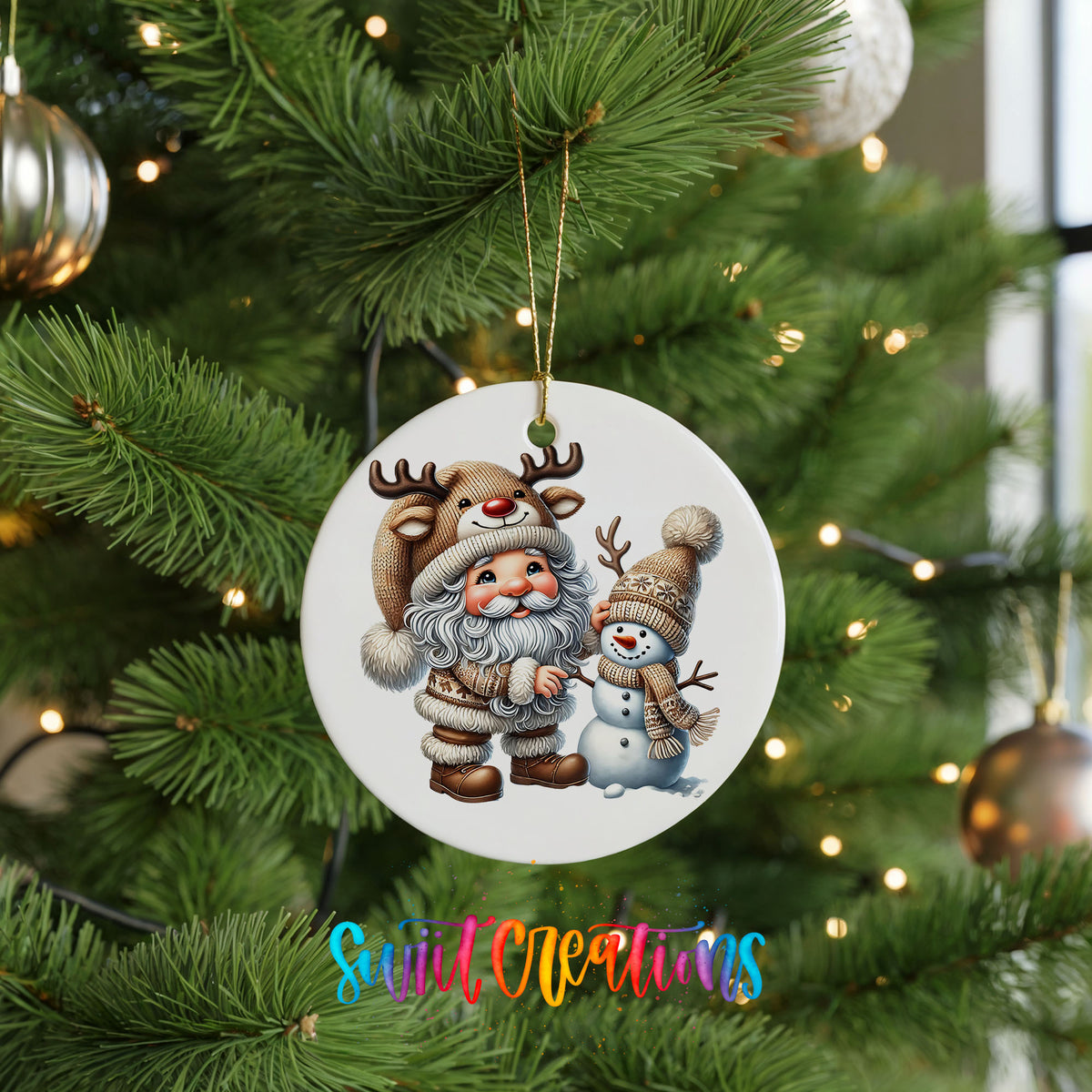 Whimsical Santa reindeer and snowman ceramic Christmas ornament hanging on a green Christmas tree