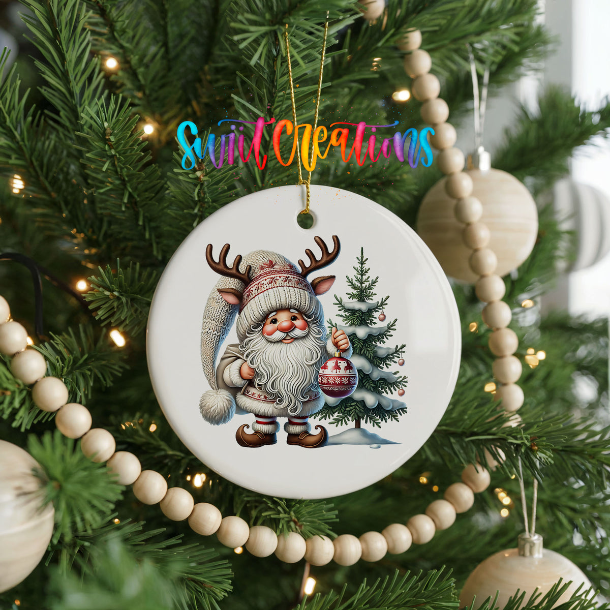 Cozy Santa with reindeer hat and Christmas tree ceramic ornament hanging on a decorated Christmas tree