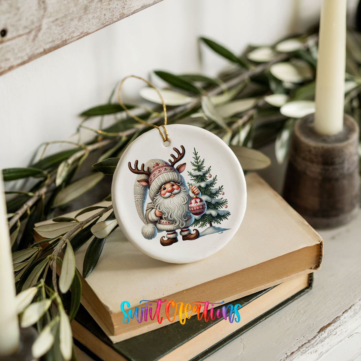 Cozy Santa with reindeer hat and Christmas tree ceramic ornament styled on books with holiday greenery