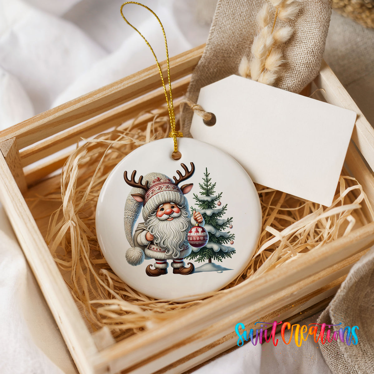 Cozy Santa with reindeer hat and Christmas tree ceramic ornament displayed in a rustic wooden gift crate