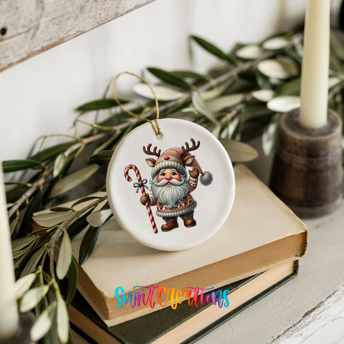 Whimsical Santa with candy cane ceramic Christmas ornament styled on books with holiday greenery