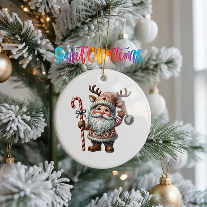 Whimsical Santa with candy cane ceramic Christmas ornament hanging on a frosted Christmas tree