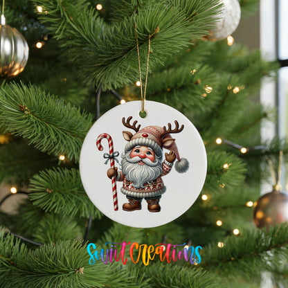 Whimsical Santa with candy cane ceramic Christmas ornament hanging on a green Christmas tree