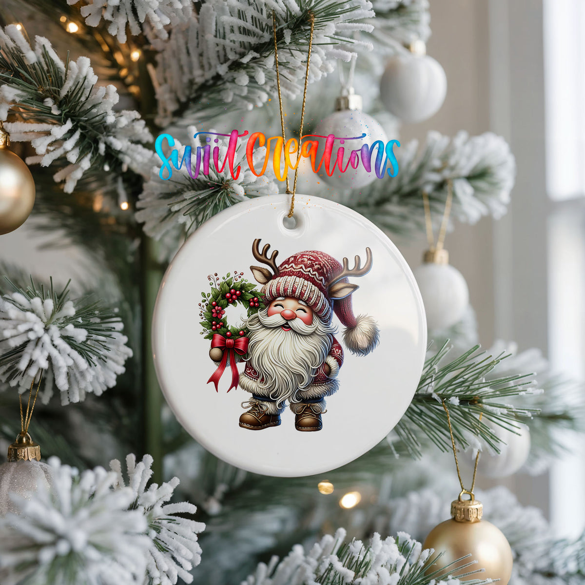 Cozy Santa holding a Christmas wreath ceramic ornament hanging on a frosted Christmas tree