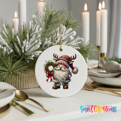 Cozy Santa holding a Christmas wreath ceramic ornament displayed with elegant holiday table decor