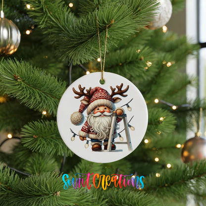 Santa decorating Christmas lights ceramic ornament hanging on a green Christmas tree