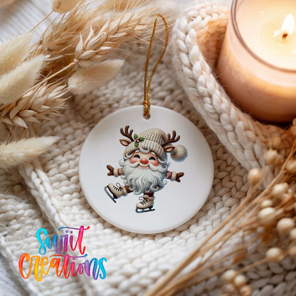 Santa ice skating ceramic Christmas ornament styled beside a candle and cozy knit blanket