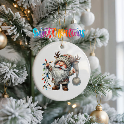 Santa holding colorful Christmas lights ceramic ornament hanging on a frosted Christmas tree