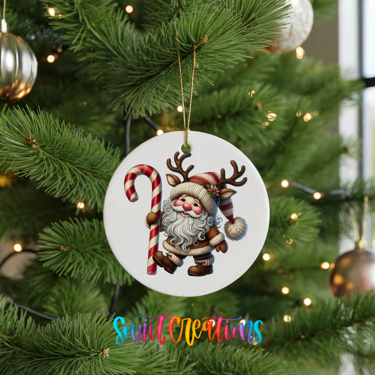 Santa holding an oversized candy cane ceramic Christmas ornament hanging on a green Christmas tree