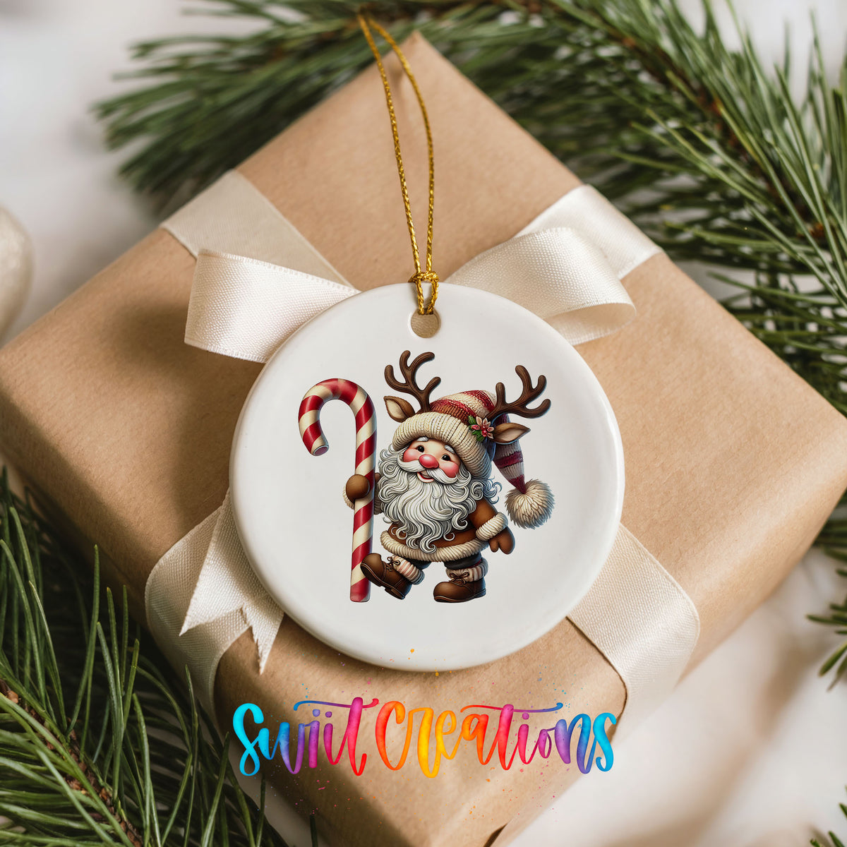 Santa holding an oversized candy cane ceramic Christmas ornament arranged on a wrapped Christmas gift