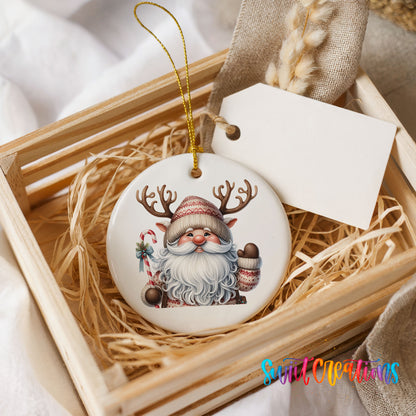 Round ceramic Christmas ornament featuring Santa holding a candy cane and mug of cocoa, presented in a rustic wooden gift crate