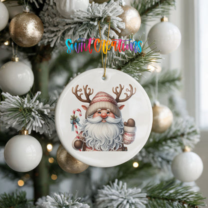 Round ceramic Christmas ornament featuring Santa holding a candy cane and mug of cocoa, hanging on a frosted holiday tree