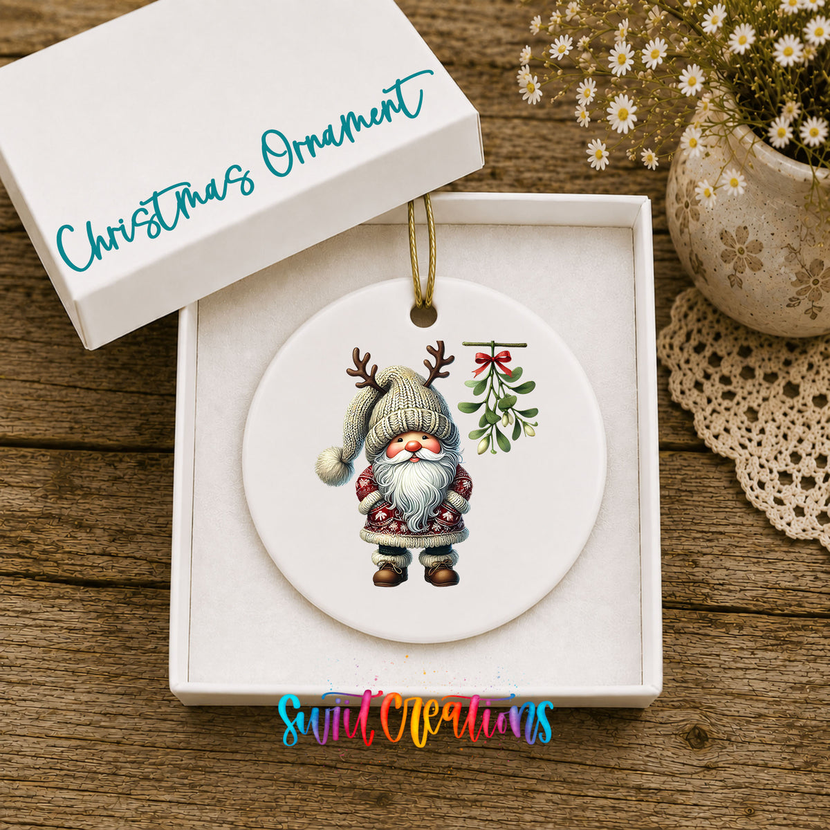 Round ceramic Christmas ornament featuring Santa standing beneath Christmas mistletoe, displayed in the included gift box