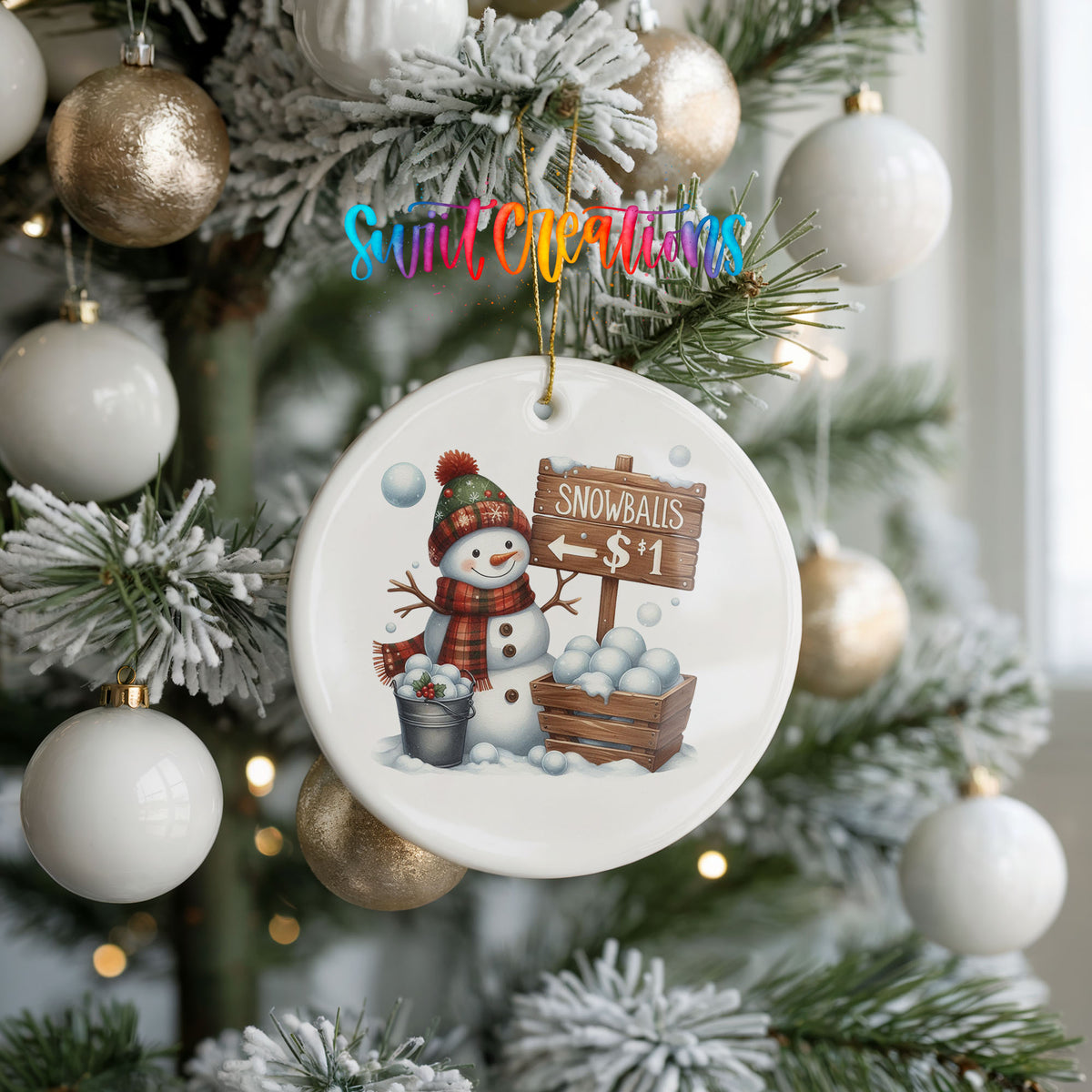 Round ceramic Christmas ornament featuring cheerful snowman selling snowballs for five cents, hanging on a frosted holiday tree