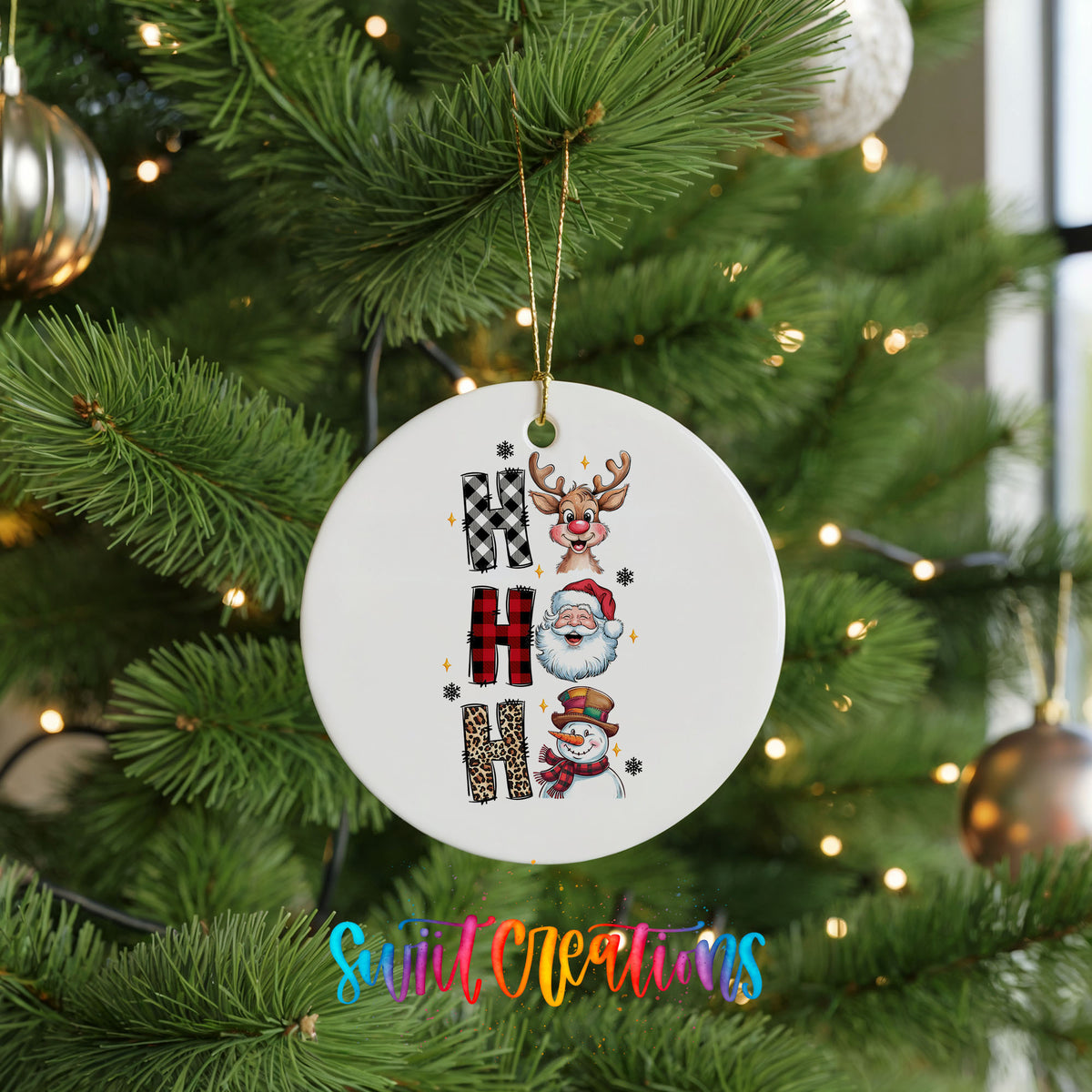 Round ceramic Christmas ornament featuring stacked Ho Ho Ho lettering with cheerful holiday characters, hanging on a green Christmas tree