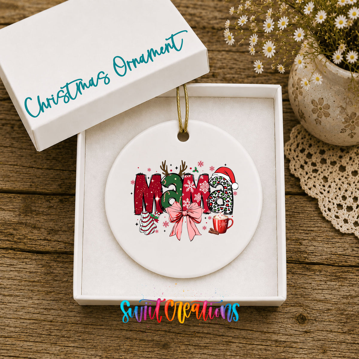 Round ceramic Christmas ornament featuring festive patterned Mama lettering with a large red holiday bow, displayed in the included gift box