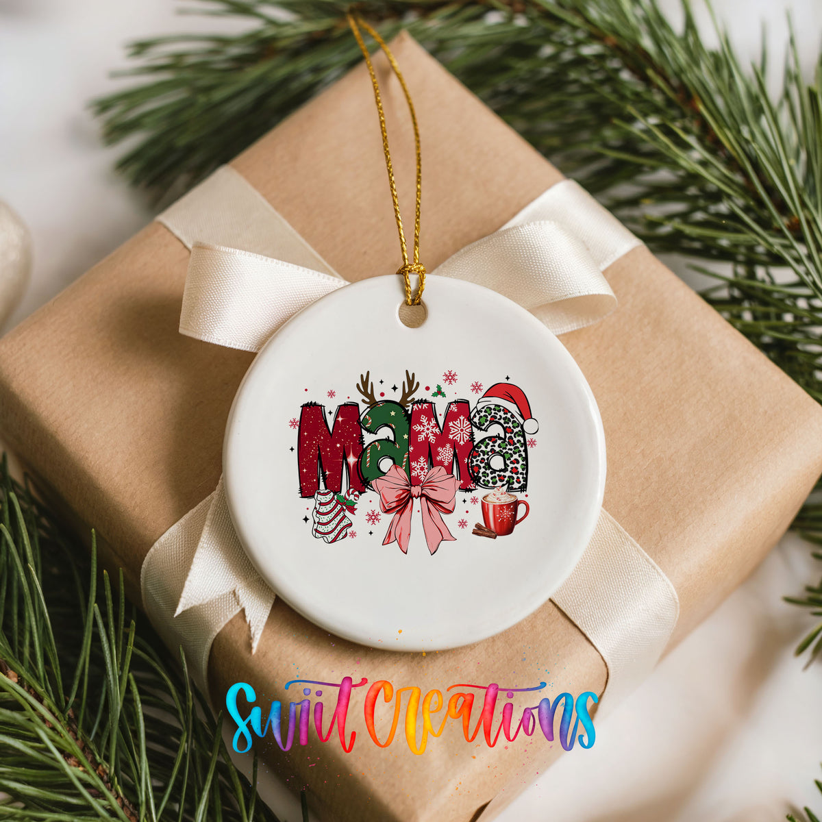 Round ceramic Christmas ornament featuring festive patterned Mama lettering with a large red holiday bow, placed on a wrapped Christmas gift