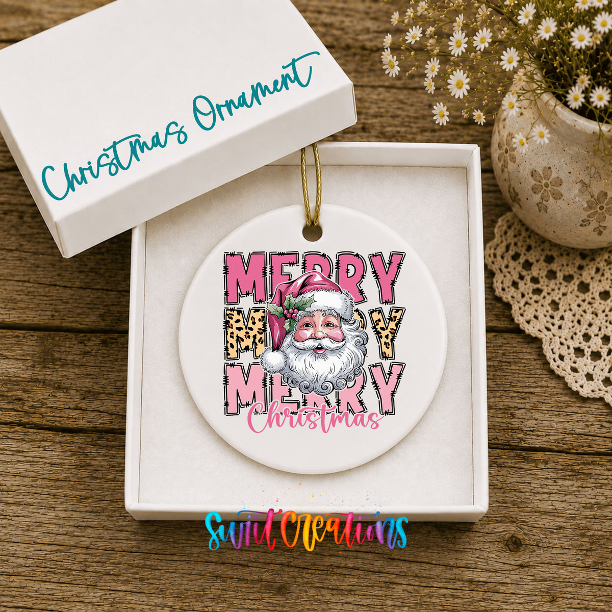 Round ceramic Christmas ornament featuring stacked Merry Merry Merry Christmas lettering with Santa and leopard print accents, displayed in the included gift box