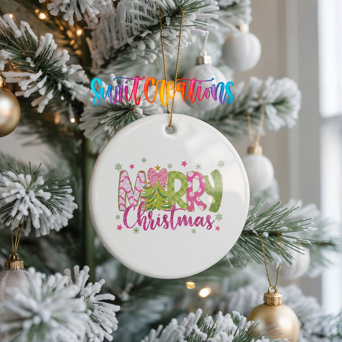 Round ceramic Christmas ornament featuring bright Merry Christmas lettering with candy stripe and floral details, hanging on a frosted Christmas tree