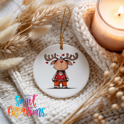 Reindeer Girl in Red Dress Christmas ornament styled beside a candle and cozy knit blanket