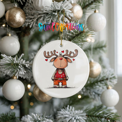 Reindeer Girl in Red Dress Christmas ornament hanging on a frosted holiday tree