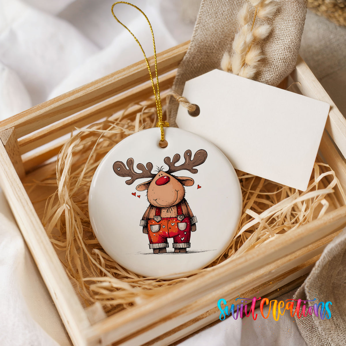 Reindeer in Red Plaid Overalls Christmas ornament presented in a rustic wooden gift crate