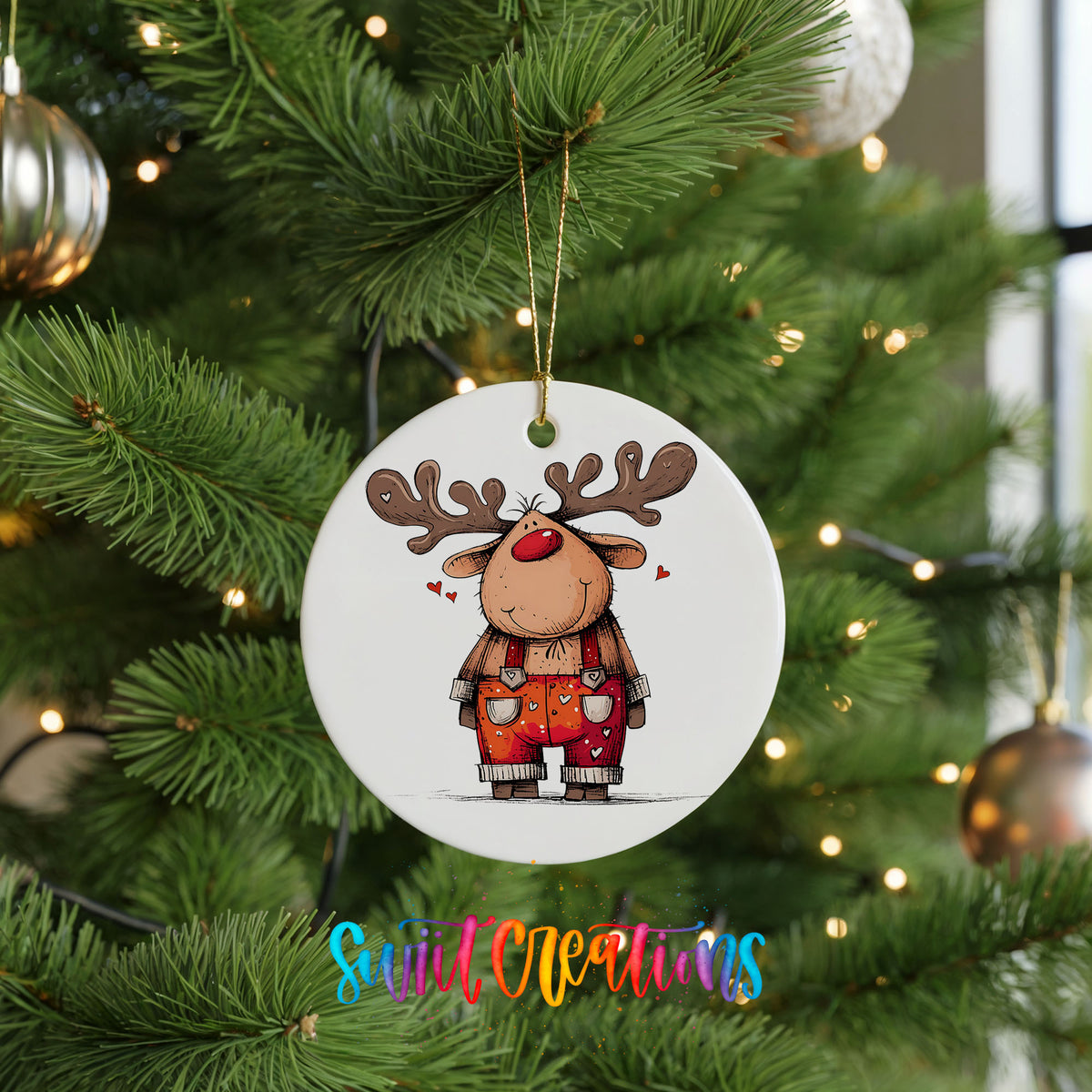Reindeer in Red Plaid Overalls Christmas ornament hanging on a green Christmas tree