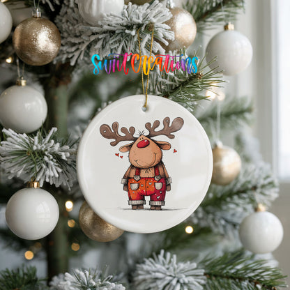 Reindeer in Red Plaid Overalls Christmas ornament hanging on a frosted holiday tree