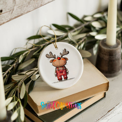 Reindeer in Red Plaid Outfit Christmas ornament styled on books with holiday greenery