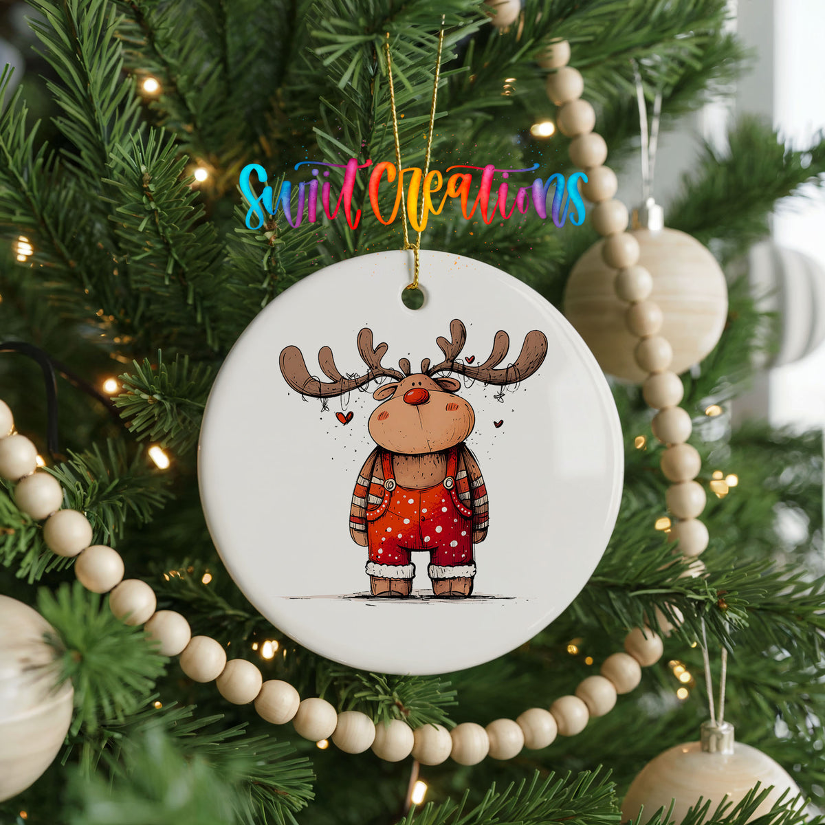 Reindeer in Red Sweater and Black Boots Christmas ornament hanging on a decorated Christmas tree